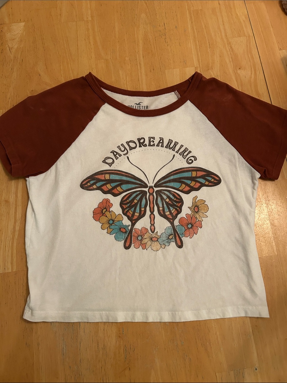 Hollister White Tee with Rust Raglan Sleeves and Multicolor Butterfly Graphic